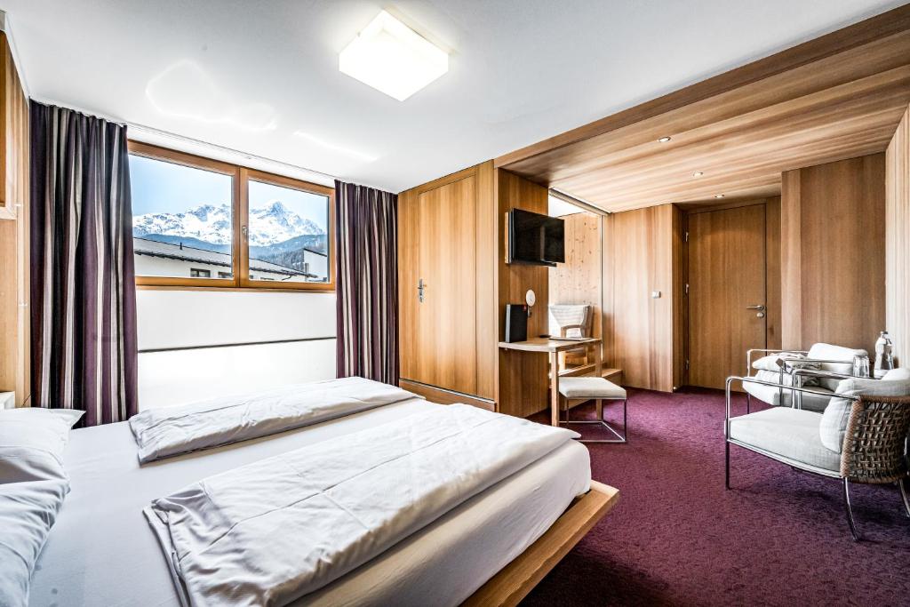 Postel nebo postele na pokoji v ubytování Hotel Alpina Sölden - Adults Only