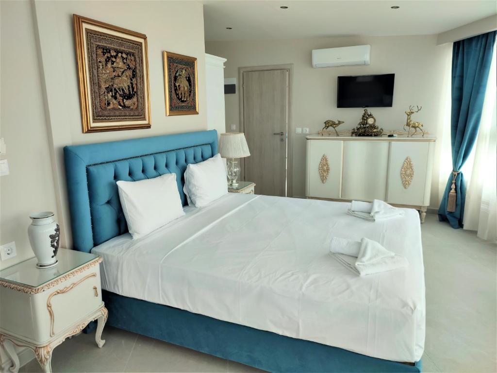 Postel nebo postele na pokoji v ubytování Light Blue Hotel