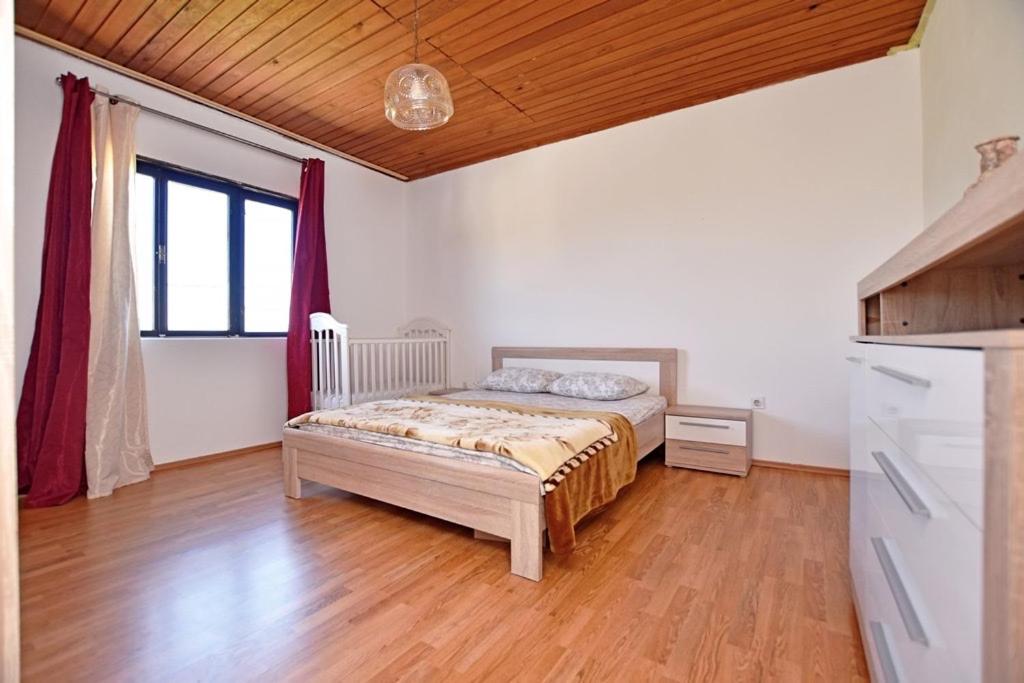 a bedroom with a bed in a room at Country House Vukmanovic Bukovik in Virpazar