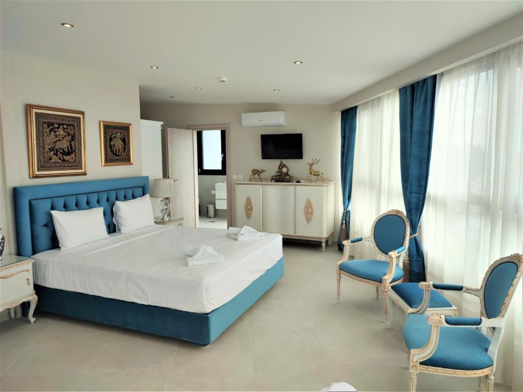 Postel nebo postele na pokoji v ubytování Light Blue Hotel