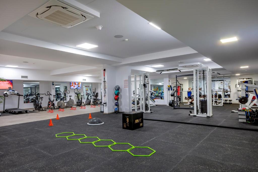 a gym with a lot of equipment and orange cones at Hotel Rural Brícia Du Mar in Ferragudo