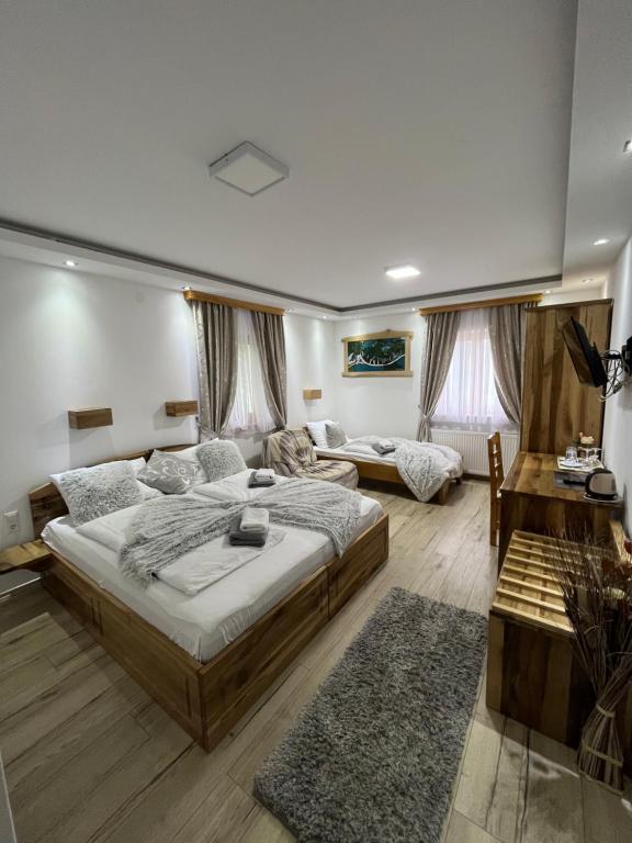 Posteľ alebo postele v izbe v ubytovaní Rustic Inn River