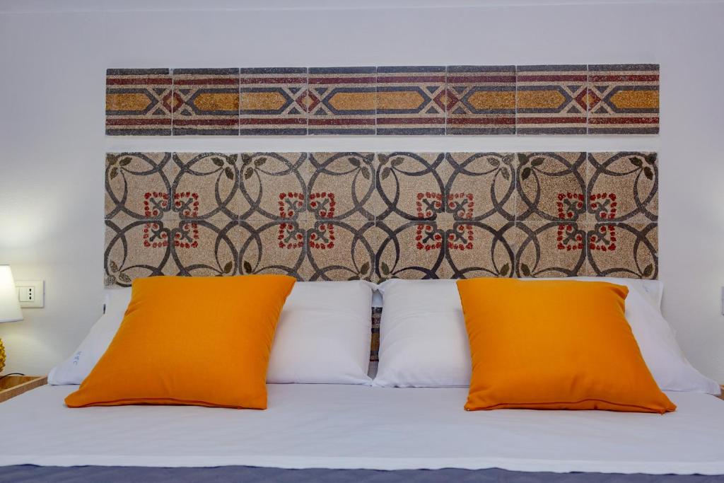 Postel nebo postele na pokoji v ubytování NottInCentro -Guest House-