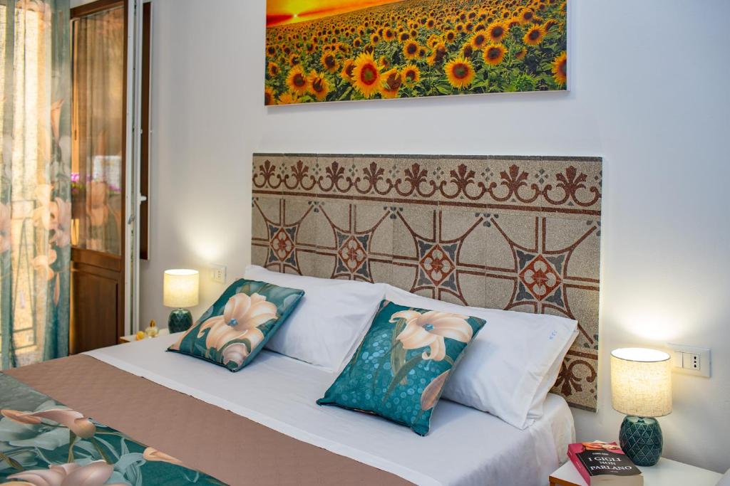 Postel nebo postele na pokoji v ubytování NottInCentro -Guest House-