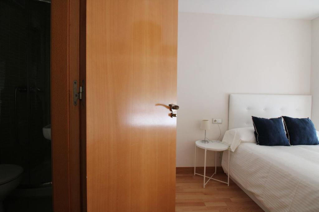 Postel nebo postele na pokoji v ubytování Adosinda Suite