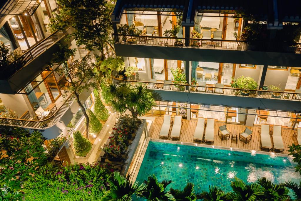 an overhead view of an apartment building with a swimming pool at CHiEM HoiAn - The Beachside Boutique Hotel & Villa in Hoi An