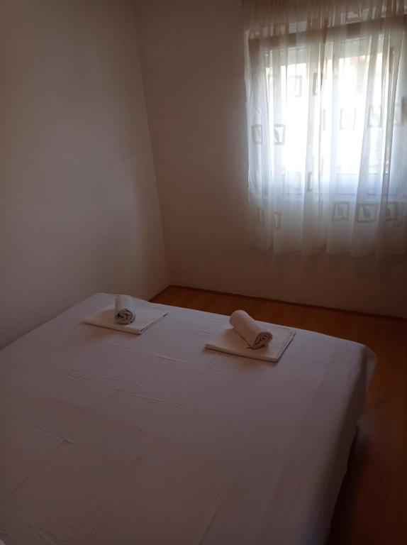 Postel nebo postele na pokoji v ubytování Apartments Milinkovic