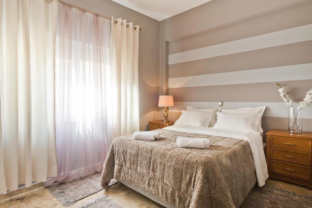 Postel nebo postele na pokoji v ubytování APARTMENT DOWNTOWN