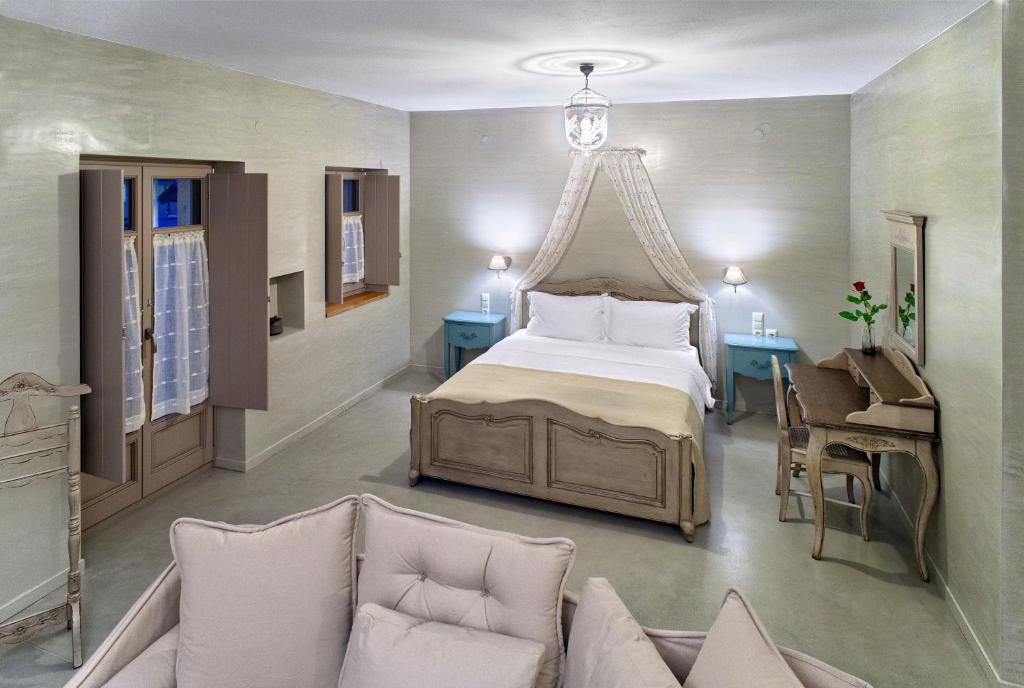 A bed or beds in a room at Haones Suites
