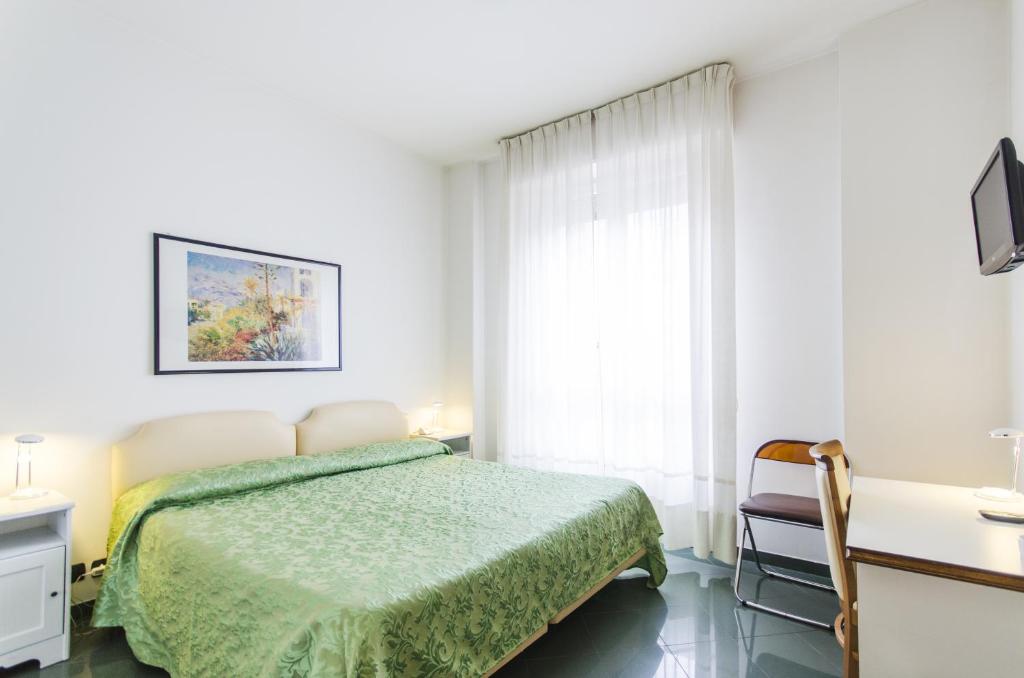 Postel nebo postele na pokoji v ubytování Hotel Molise 2
