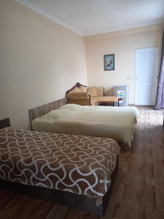 Postel nebo postele na pokoji v ubytování Magnetic Sand Hotel