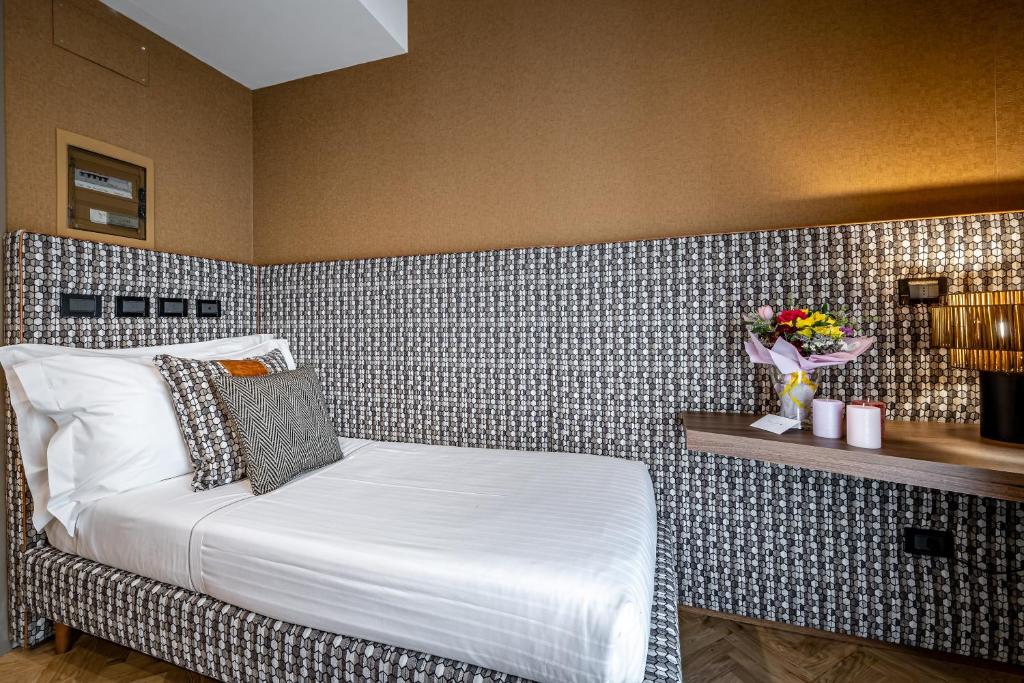 Postel nebo postele na pokoji v ubytování Hotel Duomo Firenze