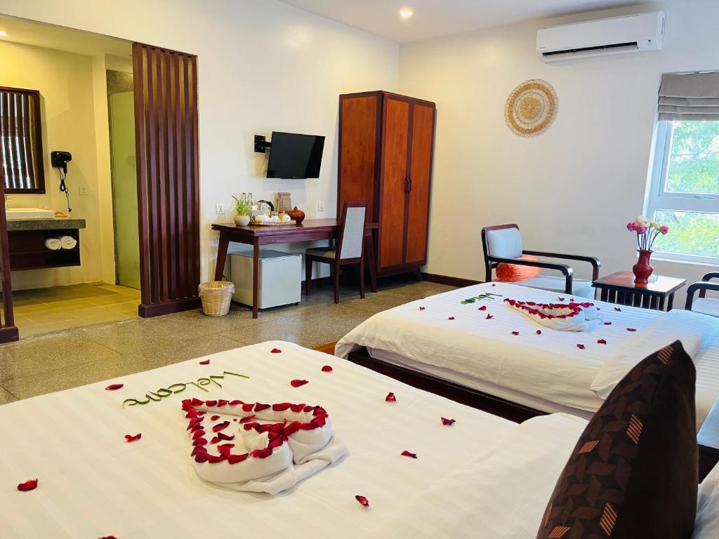 Postel nebo postele na pokoji v ubytování Indra Angkor Residence