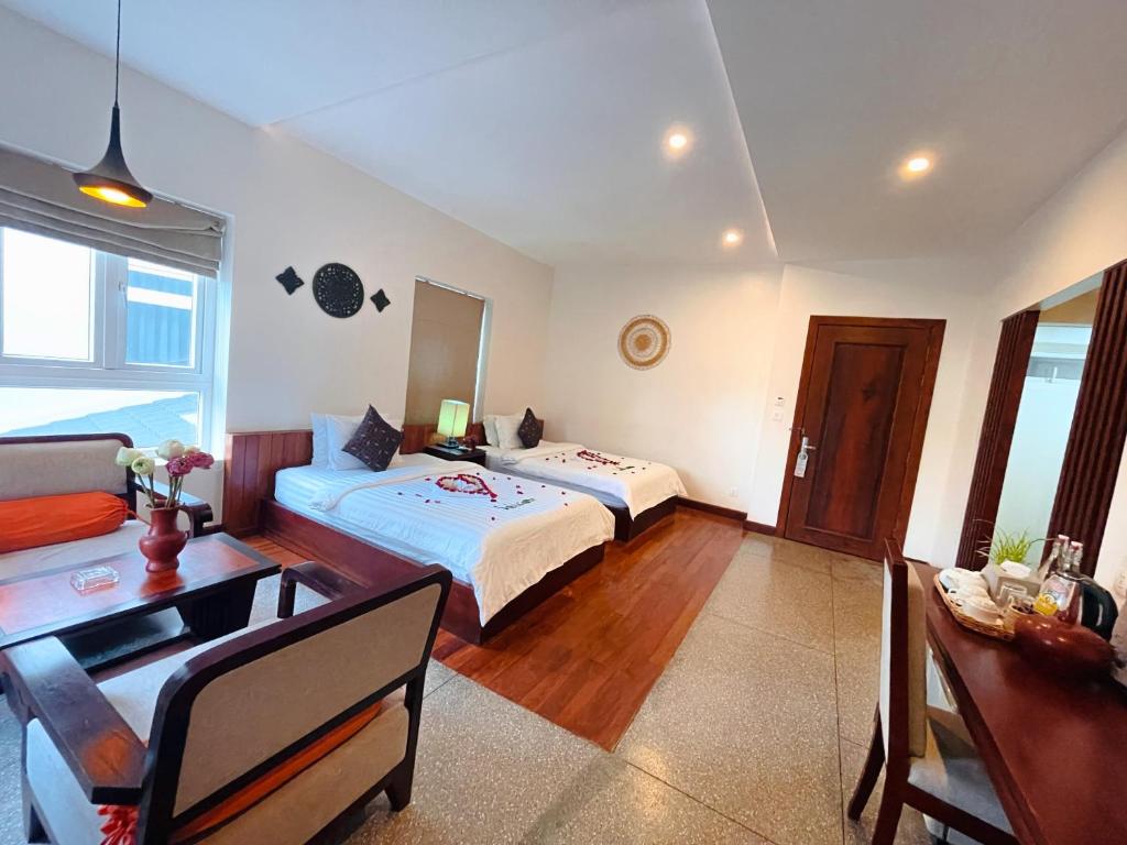 Postel nebo postele na pokoji v ubytování Indra Angkor Residence