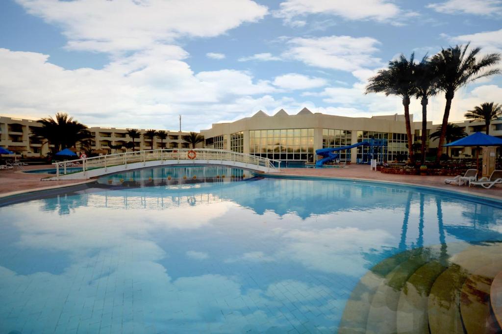 a large swimming pool in front of a hotel at Aurora Oriental Resort Sharm El Sheikh in Sharm El Sheikh