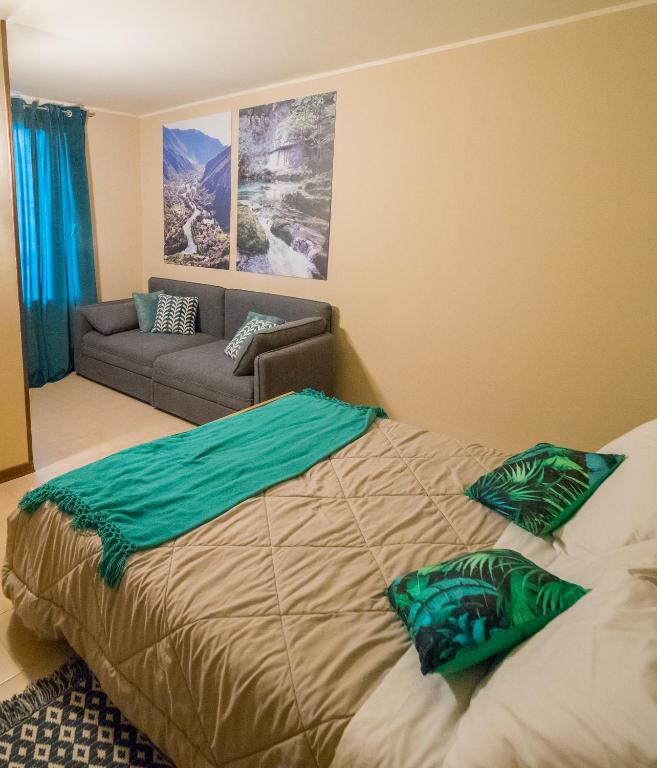 Postel nebo postele na pokoji v ubytování Rafting Hotel Ai Cavallini