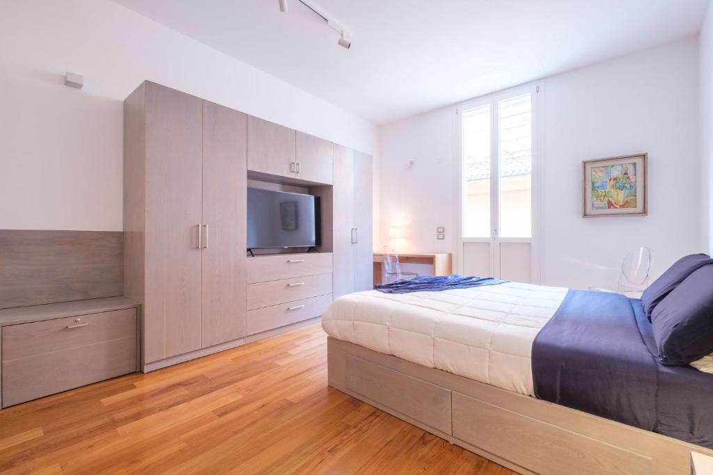 Posteľ alebo postele v izbe v ubytovaní D'Azeglio & Galluzzi Suites