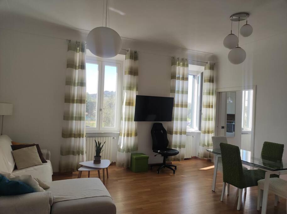 a living room with a couch and a table at Casa Mancini in Rome