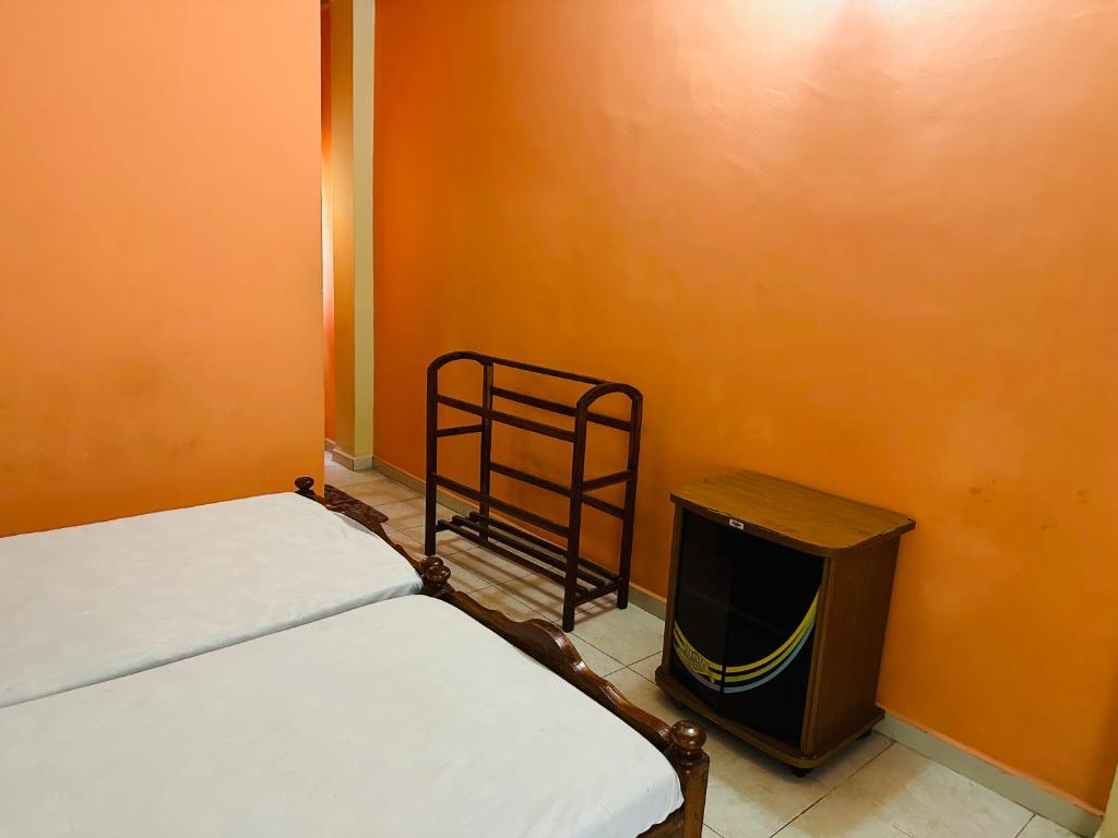 Postel nebo postele na pokoji v ubytování Hotel Prasanna