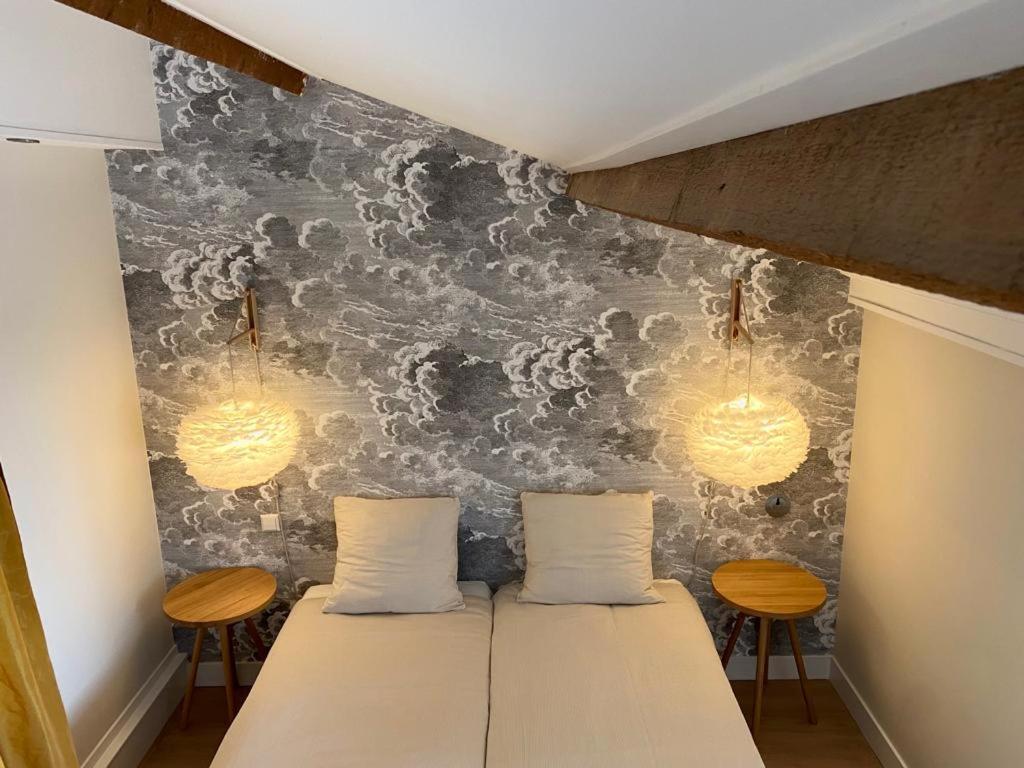 Een bed of bedden in een kamer bij Hotel Steeds aan Zee