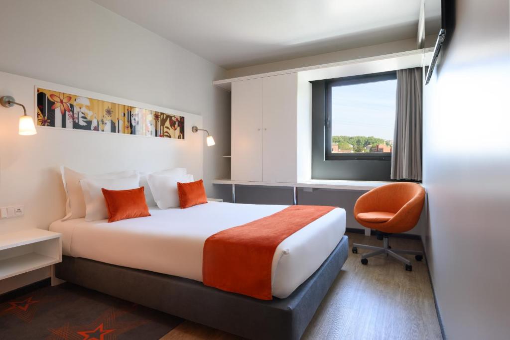 Ένα ή περισσότερα κρεβάτια σε δωμάτιο στο Star Inn Porto