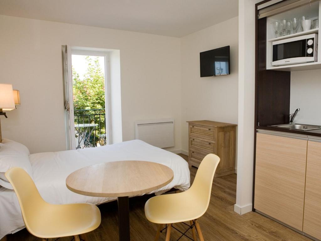 Kuchyň nebo kuchyňský kout v ubytování Hotel Residence Alaïa