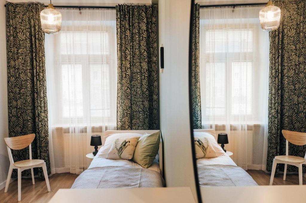 Кровать или кровати в номере Apartamenty Optimal