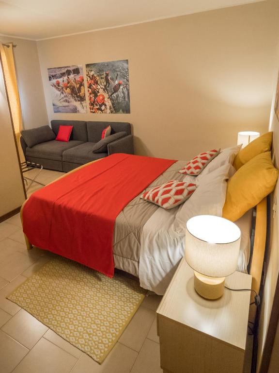 Postel nebo postele na pokoji v ubytování Rafting Hotel Ai Cavallini