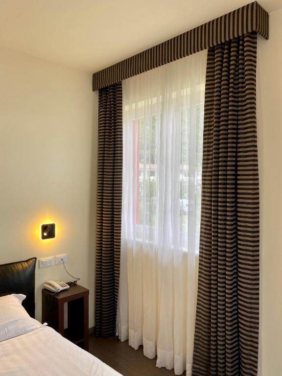 Postel nebo postele na pokoji v ubytování Hotel Campagnola