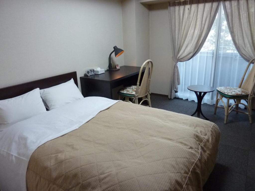 Postel nebo postele na pokoji v ubytování Sawa Hotel