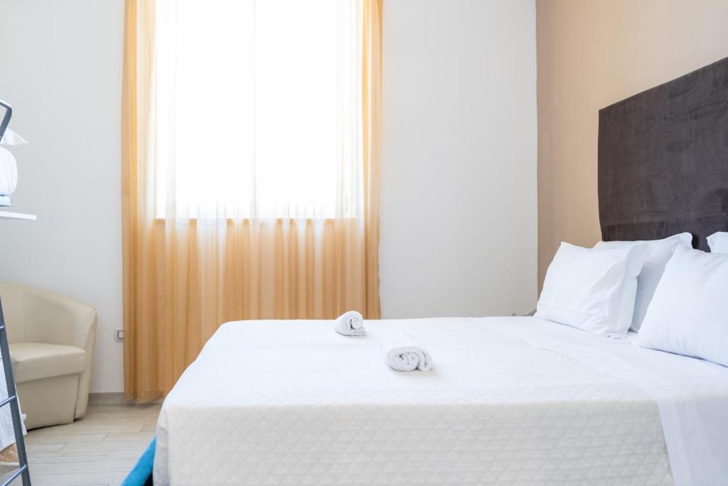 Postel nebo postele na pokoji v ubytování Hotel Reverse