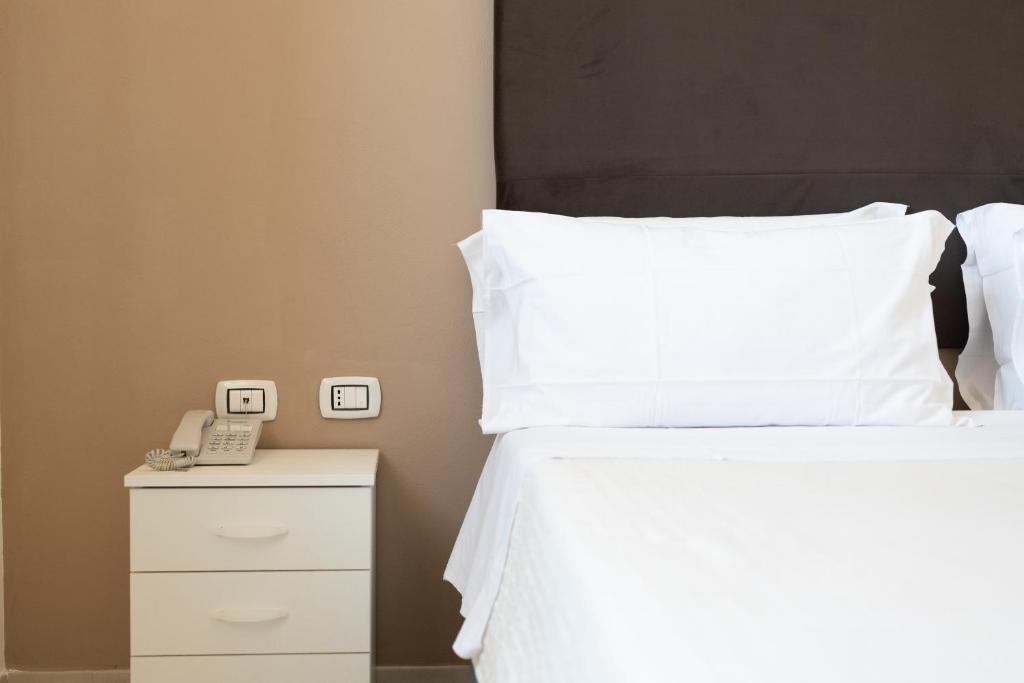 Postel nebo postele na pokoji v ubytování Hotel Reverse