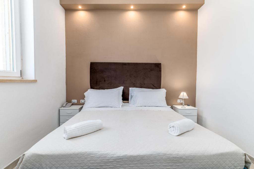 Postel nebo postele na pokoji v ubytování Hotel Reverse