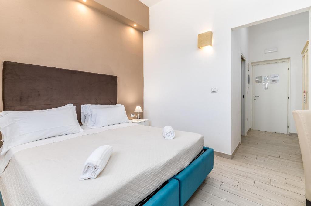 Postel nebo postele na pokoji v ubytování Hotel Reverse