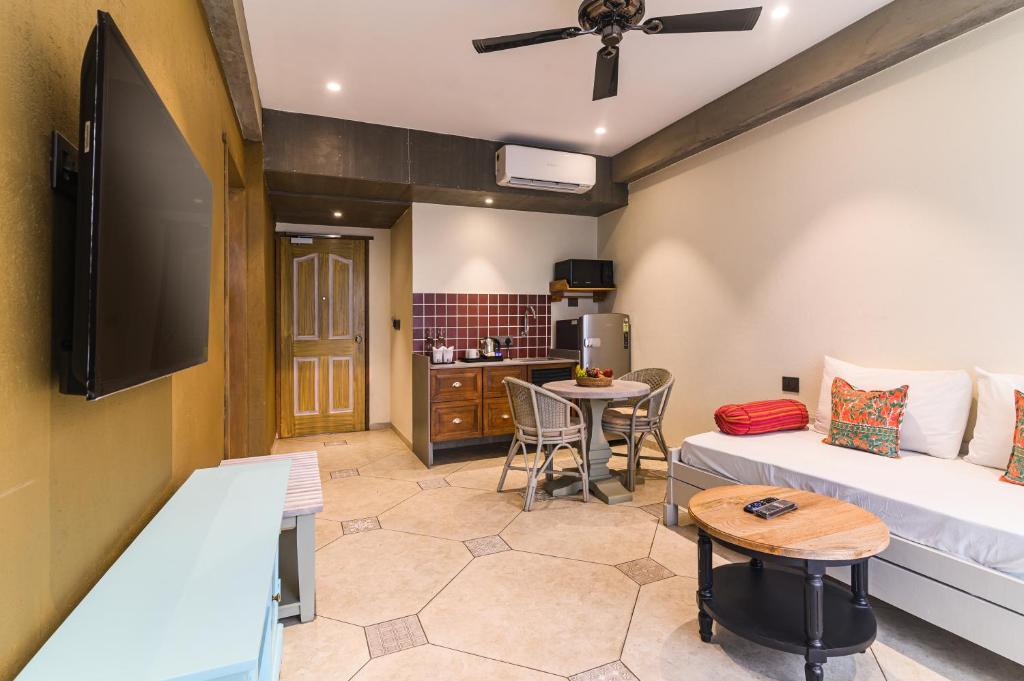 TV a/nebo společenská místnost v ubytování Bougainvilla Apartment