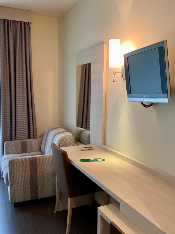 TV a/nebo společenská místnost v ubytování Hotel Campagnola