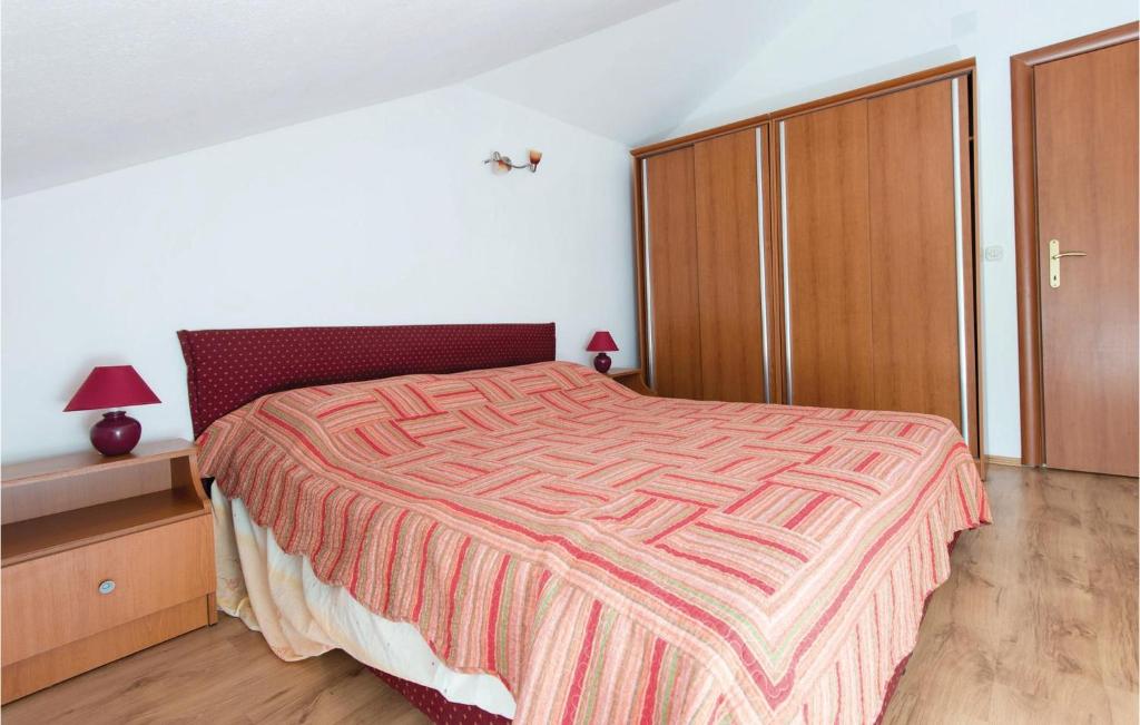 Postel nebo postele na pokoji v ubytování Apartment Ston - 07