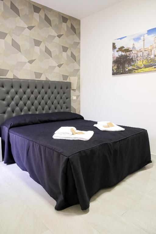 Postel nebo postele na pokoji v ubytování Hotel Terrazza Magenta