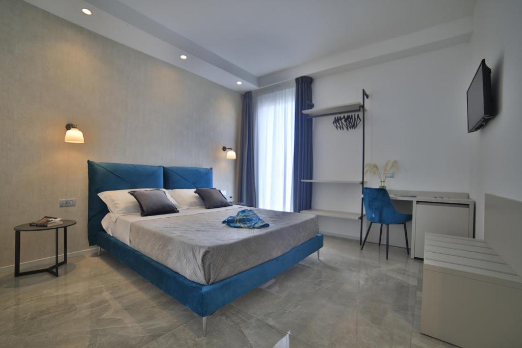 Posteľ alebo postele v izbe v ubytovaní Calaluna Rooms