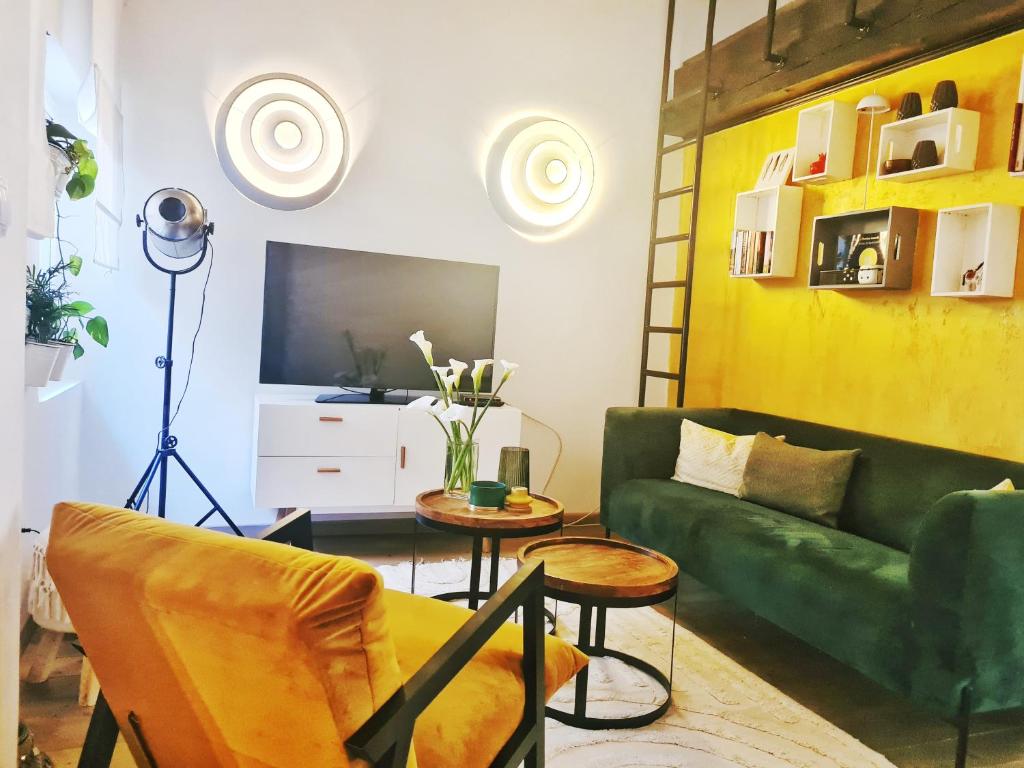 Televízia a/alebo spoločenská miestnosť v ubytovaní Grisia 26 Apartment