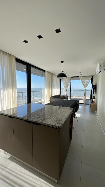 a kitchen with a island with a counter top at Alma de mar in Mar del Plata