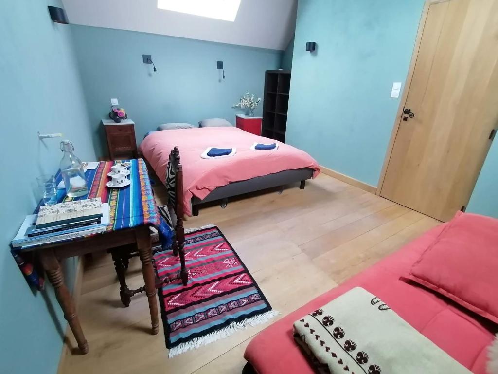 Postel nebo postele na pokoji v ubytování Le Temps Serein