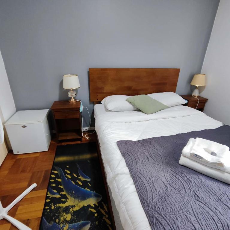 Postel nebo postele na pokoji v ubytování HOSTAL SUZI