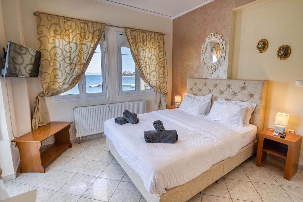 Postel nebo postele na pokoji v ubytování Votsalakia Hotel & Luxury Apartments
