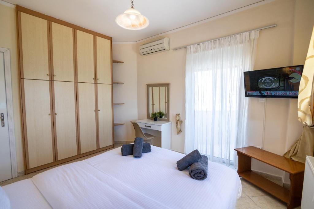 Postel nebo postele na pokoji v ubytování Votsalakia Hotel & Luxury Apartments