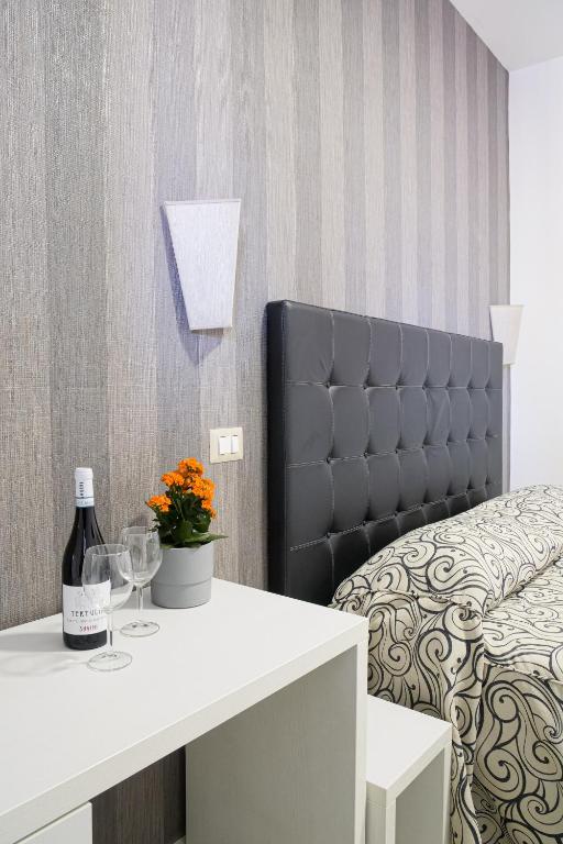 Postel nebo postele na pokoji v ubytování Hotel Terrazza Magenta