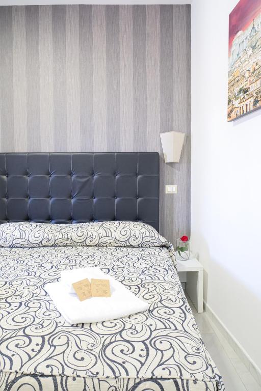 Postel nebo postele na pokoji v ubytování Hotel Terrazza Magenta