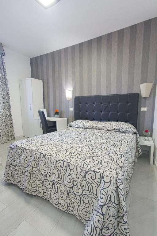 Postel nebo postele na pokoji v ubytování Hotel Terrazza Magenta