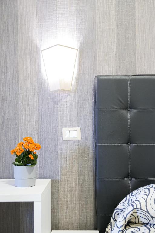 Postel nebo postele na pokoji v ubytování Hotel Terrazza Magenta