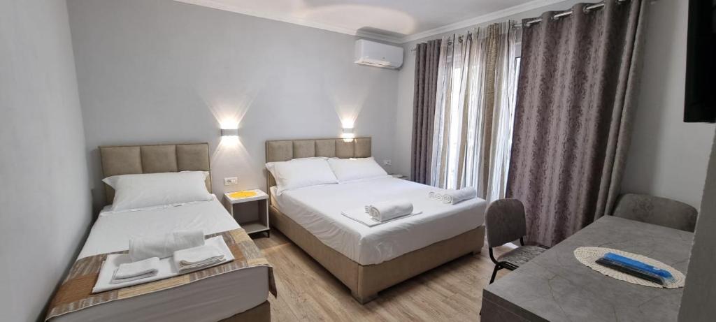 Postel nebo postele na pokoji v ubytování AAA Apartment